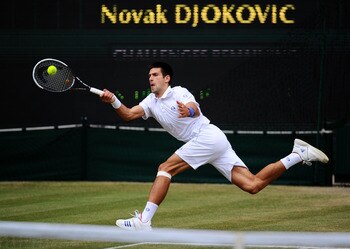 LONDON, ENGLAND - JULY 01:  Novak Djokovic of Serbia returns a shot during his semifinal round match against Jo-Wilfried Tsonga of France on Day Eleven of the Wimbledon Lawn Tennis Championships at the All England Lawn Tennis and Croquet Club on July 1, 2