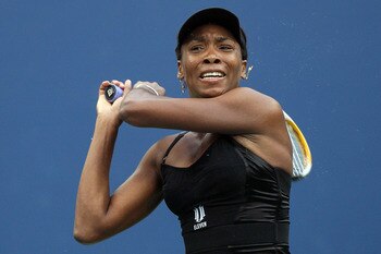 NEW YORK - SEPTEMBER 10:  Venus Williams of the United States returns a shot against Kim Clijsters of Belgium during her women's semifinal match on day twelve of the 2010 U.S. Open at the USTA Billie Jean King National Tennis Center on September 10, 2010