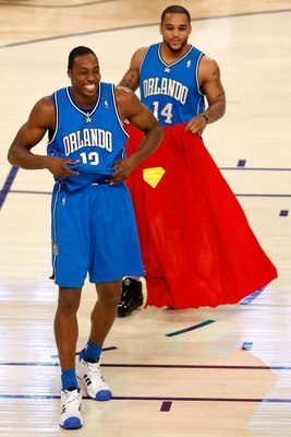NEW ORLEANS - FEBRUARY 16:  Dwight Howard of the Orlando Magic a Superman costume as teammate Jameer Nelson holds a cap for Howard's second dunk of the Sprite Slam Dunk Contest, part of 2008 NBA All-Star Weekend at the New Orleans Arena on February 16, 20