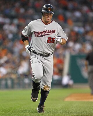 DETROIT, MI - AUGUST 15:  DH, Jim Thome #25 of the Minnesota Twins touches all the bases after hitting his first home run against the Detroit Tigers during a MLB game at Comerica Park on August 15, 2011 in Detroit, Michigan.  The Twins won 9-6 (Photo by D
