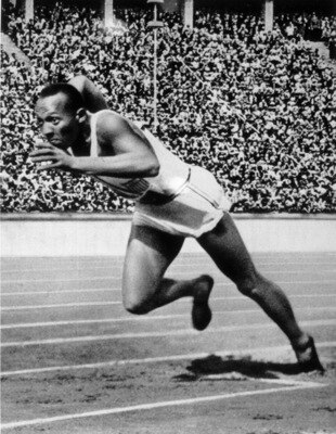 BERLIN - 1936 :  Jesse Owens of the USA in action in the mens 200m at the 1936 Summer Olympic Games held in Berlin, Germany.  Owens won a total of four gold medals in the Olympics, winning the mens 100m final, 200m final and the long jump competiton as we