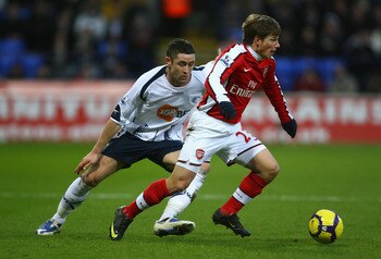 Bolton's Gary Cahill, left, is a realistic target for Arsenal