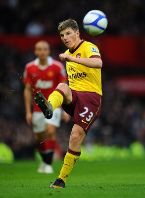 MANCHESTER, ENGLAND - MARCH 12:  Andrey Arshavin of Arsenal passes the ball during the FA Cup sponsored by E.On Sixth Round match between Manchester United and Arsenal at Old Trafford on March 12, 2011 in Manchester, England.  (Photo by Clive Mason/Getty