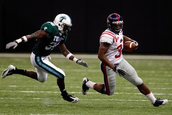 NEW ORLEANS - SEPTEMBER 11:  Brandon Bolden #34 of the Ole Miss Rebels is chased by Dominique Robertson #36 of the Tulane Green Wave at the Louisiana Superdome on September 11, 2010 in New Orleans, Louisiana.  (Photo by Chris Graythen/Getty Images)