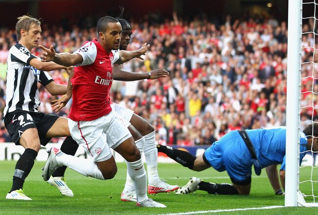 LONDON, ENGLAND - AUGUST 16:  Theo Walcott of Arsenal celebrates scoring the opening goal during the UEFA Champions League play-off first leg match between Arsenal and Udinese at the Emirates Stadium on August 16, 2011 in London, England.  (Photo by Julia