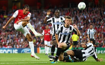 LONDON, ENGLAND - AUGUST 16:  The Udinese defence attempt to block the shot by Marouane Chamakh of Arsenal during the UEFA Champions League play-off first leg match between Arsenal and Udinese at the Emirates Stadium on August 16, 2011 in London, England.
