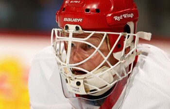 DENVER - DECEMBER 27:  Goalie Chris Osgood #30 of the Detroit Red Wings defends the goal against the Colorado Avalanche at the Pepsi Center on December 27, 2010 in Denver, Colorado. Osgood earned his 400th win and collected 46 saves as the Red Wings defea