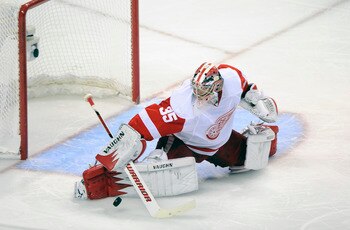 SAN JOSE, CA - MAY 12: Goalie Jimmy Howard #35 the Detroit Red Wings makes a save in the second period in Game Seven of the Western Conference Semifinals  during the 2011 NHL Stanley Cup Playoffs at the HP Pavilion on May 12, 2011 in San Jose, California.