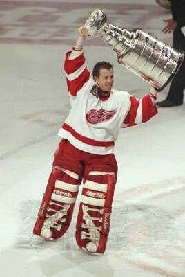 7 Jun 1997:  Goaltender Mike Vernon of the Detroit Red Wings celebrates with the Stanley Cup after a playoff game against the Philadelphia Flyers at Joe Louis Arena in Detroit, Michigan.  The Red Wings won the game, 2-1. Mandatory Credit: Al Bello  /Allsp