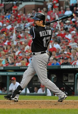 ST. LOUIS, MO - AUGUST 13: Todd Helton #17 of the Colorado Rockies follows through on a two-run double during a game against the St. Louis Cardinals at Busch Stadium on August 13, 2011 in St. Louis, Missouri.  (Photo by Jeff Curry/Getty Images)