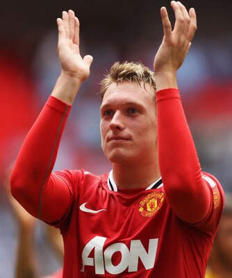 LONDON, ENGLAND - AUGUST 07:  Phil Jones of Manchester United applauds fans after victory in the FA Community Shield match sponsored by McDonald's between Manchester City and Manchester United at Wembley Stadium on August 7, 2011 in London, England.  (Pho