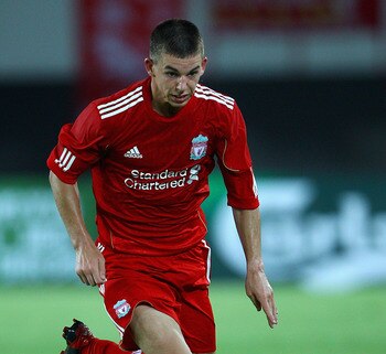GUANGZHOU, CHINA - JULY 13:  John Flanagan of Liverpool controls the ball during the pre-season friendly match between Guangdong Sunray Cave and Liverpool at Guangdong Provincial People's Stadium on July 13, 2011 in Guangzhou, China.  (Photo by Feng Li/Ge