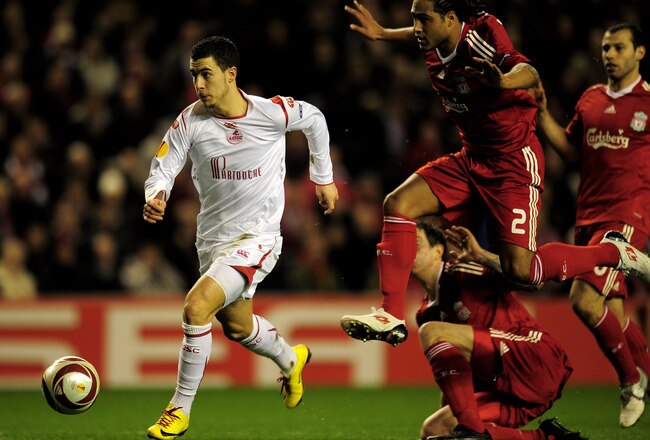 LIVERPOOL, ENGLAND - MARCH 18:  Eden Hazard of Lille breaks clear of the challenge of Glen Johnson of Liverpool during the UEFA Europa League Round of 16, second leg match at Anfield on March 18, 2010 in Liverpool, England.  (Photo by Shaun Botterill/Gett