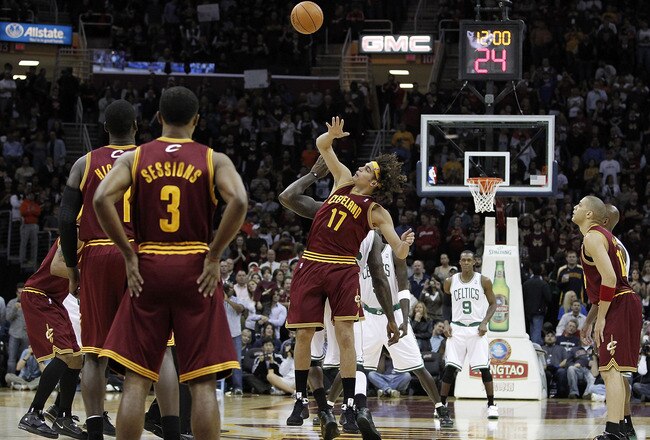 CLEVELAND - OCTOBER 27: Anderson Varejao #17 of the Cleveland Cavaliers tips a jump ball in front of Shaquille O'Neal #36 of the Boston Celtics to start the 2010 season at Quicken Loans Arena on October 27, 2010 in Cleveland, Ohio.  (Photo by Gregory Sham