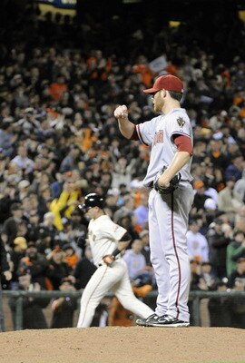 SAN FRANCISCO, CA - AUGUST 1: Ian Kennedy #31 of the Arizona Diamondbacks gives up a home run to Aubrey Huff #17 of the San Francisco Giants and watches him round the bases in the seventh inning during a MLB baseball game at AT&T Park August 1, 2011 in Sa