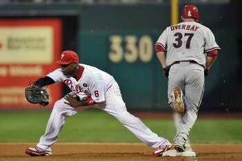 PHILADELPHIA, PA - AUGUST 16: Lyle Overbay #37 of the Arizona Diamondbacks is safe at first on an infield single as Ryan Howard #6 of the Philadelphia Phillies catches the ball at Citizens Bank Park on August 16, 2011 in Philadelphia, Pennsylvania. (Photo