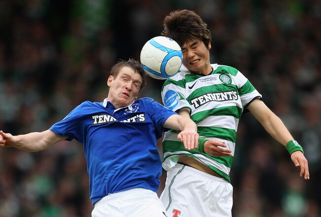 GLASGOW, SCOTLAND - MARCH 20:  Ki Sung Yueng of Celtic goes for a header with Steven Davis  of Rangers during the Co-operative Insurance Cup final between at Hampden Park on March 20, 2011 in Glasgow, Scotland.  (Photo by Julian Finney/Getty Images)