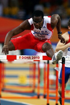 DOHA, QATAR - MARCH 12:  Dayron Robles of Cuba competes in the mens 60m hurdle heats during Day 1 of the IAAF World Indoor Championships at the Aspire Dome on March 12, 2010 in Doha, Qatar.  (Photo by Michael Steele/Getty Images)