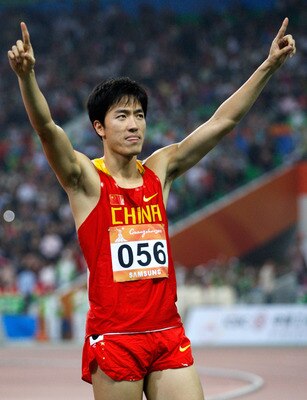 GUANGZHOU, CHINA - NOVEMBER 24:  Liu Xiang of China wins the gold medal in the Men's 110m Hurdles at Aoti Main Stadium during day twelve of the 16th Asian Games Guangzhou 2010 on November 24, 2010 in Guangzhou, China.  (Photo by Ronald Martinez/Getty Imag