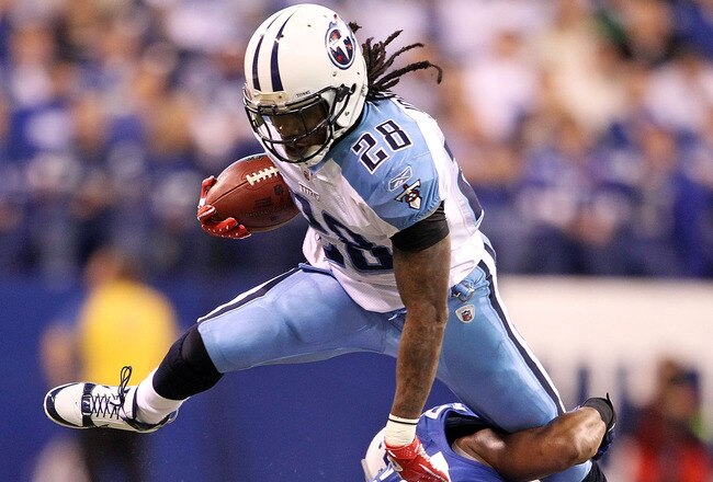 INDIANAPOLIS - JANUARY 02:  Chris Johnson #28 of the Tennessee Titans is tackled by Jacob Lacey #27 of the Indianapolis Colts at Lucas Oil Stadium on January 2, 2011 in Indianapolis, Indiana.  the Colts won 23-20.  (Photo by Andy Lyons/Getty Images)