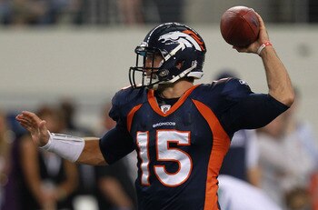 Tim Tebow throws a pass