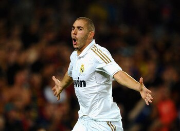 BARCELONA, SPAIN - AUGUST 17: Karim Benzema of Real Madrid celebrates scoring the second goal during the Super Cup second leg match between Barcelona and Real Madrid at Nou Camp on August 17, 2011 in Barcelona, Spain.  (Photo by Laurence Griffiths/Getty I