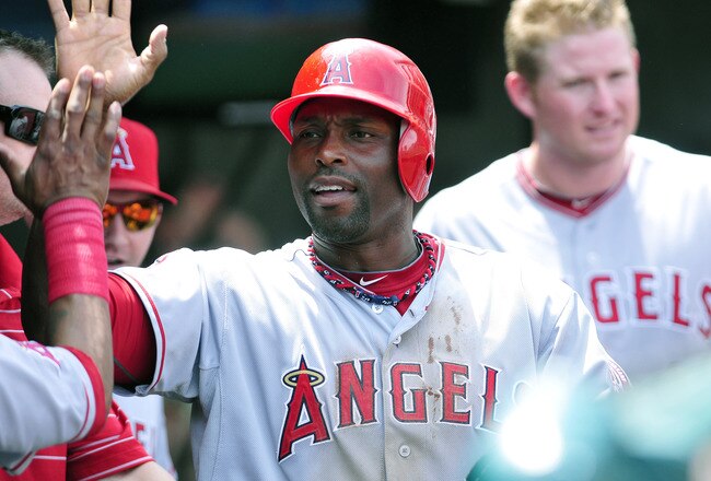 CLEVELAND, OH - JULY 27: Tori Hunter # 48 of the Los Angeles Angels of Anaheim celebrates in the dugout after scoring on an error during the sixth inning against the Cleveland Indians at Progressive Field on July 27, 2011 in Cleveland, Ohio. (Photo by Jas