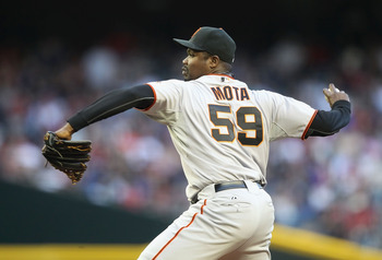 PHOENIX, AZ - APRIL 16:  Relief pitcher Guillermo Mota #59 of the San Francisco Giants pitches against the Arizona Diamondbacks during the Major League Baseball game at Chase Field on April 16, 2011 in Phoenix, Arizona. The Giants defeated the Diamondback