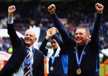 KILMARNOCK, SCOTLAND - MAY 15:  Rangers manager, Walter Smith and Ally McCoist, assistant manager celebrate after winning the Clydesdale Bank Premier League at Rugby Park on May 15, 2011 in Kilmarnock, Scotland..  (Photo by Jeff J Mitchell/Getty Images)