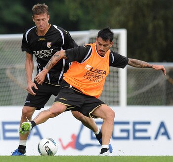 BOLZANO, ITALY - JULY 11:  Mauricio Pinilla (R) and Dorin Goian in action during a Palermo training session at Sport Well Center on July 11, 2011 in Malles Venosta, near Bolzano, Italy.  (Photo by Tullio M. Puglia/Getty Images)