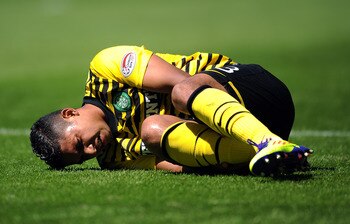EDINBURGH, SCOTLAND - JULY 24: Emilio Izaguirre of Celtic lies injured during the Clydesdale Bank Premier League match between Hibernian and Celtic at Easter Road on July 24, 2011 in Edinburgh, Scotland.  (Photo by Chris Brunskill/Getty Images)