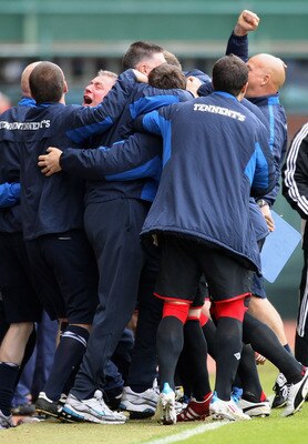 KILMARNOCK, SCOTLAND - MAY 15:  Ally McCoist of Rangers is surrounded by staff as they celebrate a goal during the Clydesdale Bank Premier League match between Kilmarnock  and Rangers at Rugby Park on May 15, 2011 in Kilmarnock, Scotland  (Photo by Jeff J