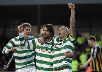 BERWICK, ENGLAND-JANUARY 09: Daniel Majstorovic of Celtic celebrates with Georgious Samaras and Thomas Rogne after scoring during the Scottish FA Cup 4th Round match between Berwick Rangers and Celtic at Shielfield Park, on January 09, 2011 in Berwick, Un