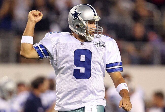 ARLINGTON, TX - OCTOBER 25:  Quarterback Tony Romo #9 of the Dallas Cowboys celebrates a touchdown by Jason Witten against the New York Giants in the first quarter at Cowboys Stadium on October 25, 2010 in Arlington, Texas.  (Photo by Ronald Martinez/Gett