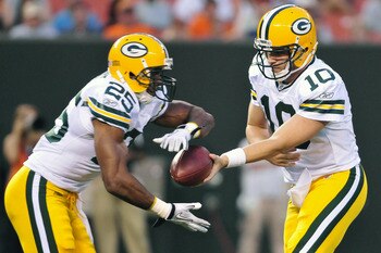 CLEVELAND, OH - AUGUST 13: Quarterback Matt Flynn #10 hands off to Ryan Grant #25 of the Green Bay Packers during the second quarter at Cleveland Browns Stadium on August 13, 2011 in Cleveland, Ohio. The Browns defeated the Packers 27-17. (Photo by Jason