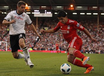 Luis Suarez, right, will play a key role in the Liverpool side hoping to compete for the Premier League title this season