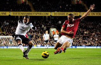 Vidic, right, goes in for a tackle against Aaron Lennon at White Hart Lane in February