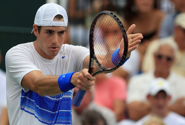 WINSTON-SALEM, NC - AUGUST 27:  John Isner of the USA reacts to a shot on his way to defeating Julien Benneteau of France during the men's singles final of the Winston-Salem Open at the Wake Forest University Tennis Complex on August 27, 2011 in Winston-S