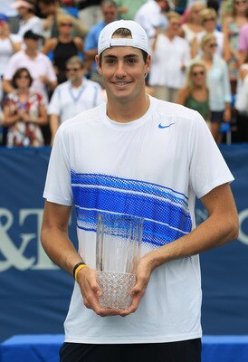 WINSTON-SALEM, NC - AUGUST 27:  John Isner of the USA holds the trophy after defeating Julien Benneteau of France during the men's singles final of the Winston-Salem Open at the Wake Forest University Tennis Complex on August 27, 2011 in Winston-Salem, No
