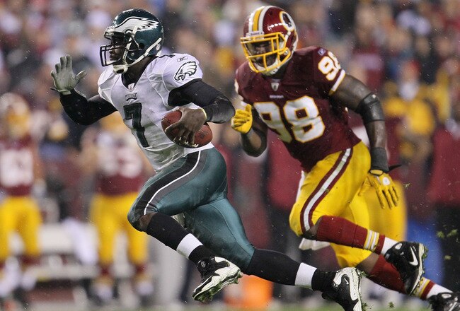 LANDOVER, MD - NOVEMBER 15:  Michael Vick #7 of the Philadelphia Eagles makes a break past Brian Orakpo #98 of the Washington Redskins on November 15, 2010 at FedExField in Landover, Maryland.  (Photo by Chris McGrath/Getty Images)