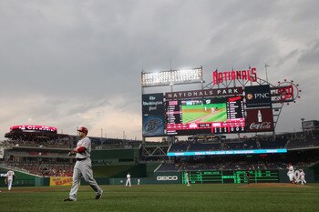 WASHINGTON, DC - AUGUST 18: Joey Votto #19 of the Cincinnati Reds walks back to the dugout after grounding out for the second out of the first inning against the Washington Nationals at Nationals Park on August 18, 2011 in Washington, DC.  (Photo by Rob C