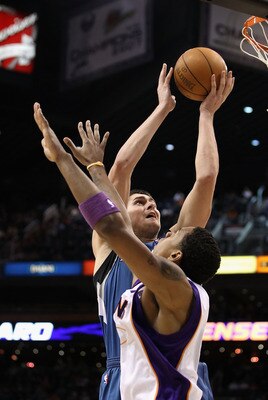 PHOENIX - DECEMBER 15:  Darko Milicic #31 of the Minnesota Timberwolves puts up a shot over Channing Frye #8 of the Phoenix Suns during the NBA game at US Airways Center on December 15, 2010 in Phoenix, Arizona. NOTE TO USER: User expressly acknowledges a