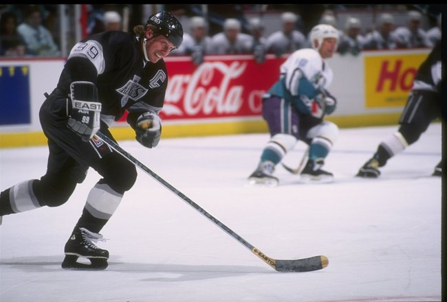 9 Apr 1995: Center Wayne Gretzky of the Los Angeles Kings moves the puck during a game against the Anaheim Mighty Ducks at Arrowhead Pond in Anaheim, California. The Mighty Ducks won the game, 5-1.