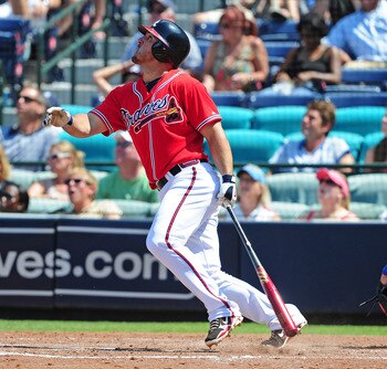 ATLANTA - AUGUST 14: Dan Uggla #26 of the Atlanta Braves hits a pop up against the Chicago Cubs at Turner Field on August 14, 2011 in Atlanta, Georgia. (Photo by Scott Cunningham/Getty Images)