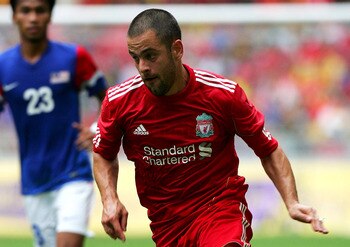 KUALA LUMPUR, MALAYSIA - JULY 16: Joe Cole of Liverpool runs with the ball during the pre-season friendly match between Malaysia and Liverpool at the Bukit Jalil National Stadium on July 16, 2011 in Kuala Lumpur, Malaysia. (Photo by Stanley Chou/Getty Ima