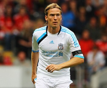 HULL, ENGLAND - JULY 23:  Christian Poulsen of Liverpool in action during the Pre Season Friendly match between Hull City and Liverpool at KC Stadium on July 23, 2011 in Hull, England.  (Photo by Matthew Lewis/Getty Images)