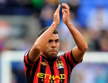 BOLTON, ENGLAND - AUGUST 21:  Carlos Tevez  of Manchester City applauds the fans at the end of the Barclays Premier League match between Bolton Wanderers and Manchester City at the Reebok Stadium on August 21, 2011 in Bolton, England.  (Photo by Michael R