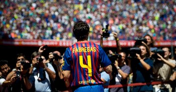 BARCELONA, SPAIN - AUGUST 15:  Cesc Fabregas poses for the photographers during his presentation as the new signing for FC Barcelona at Camp Nou sports complex on August 15, 2011 in Barcelona, Spain.  (Photo by David Ramos/Getty Images)
