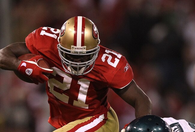 SAN FRANCISCO - OCTOBER 10:  Frank Gore #21 of the San Francisco 49ers runs against Nate Allen #29 of the Philadelphia Eagles during an NFL game at Candlestick Park on October 10, 2010 in San Francisco, California.  (Photo by Jed Jacobsohn/Getty Images)