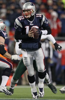 FOXBORO, MA - JANUARY 16:  Quarterback Tom Brady #12 of the New England Patriots drops back with the ball during their 2011 AFC divisional playoff game against the New York Jets at Gillette Stadium on January 16, 2011 in Foxboro, Massachusetts.  (Photo by